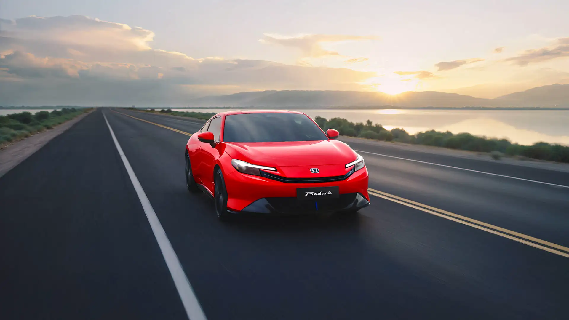 Honda Prelude vermelho em três quartos dianteiro, em estrada ao pôr do sol